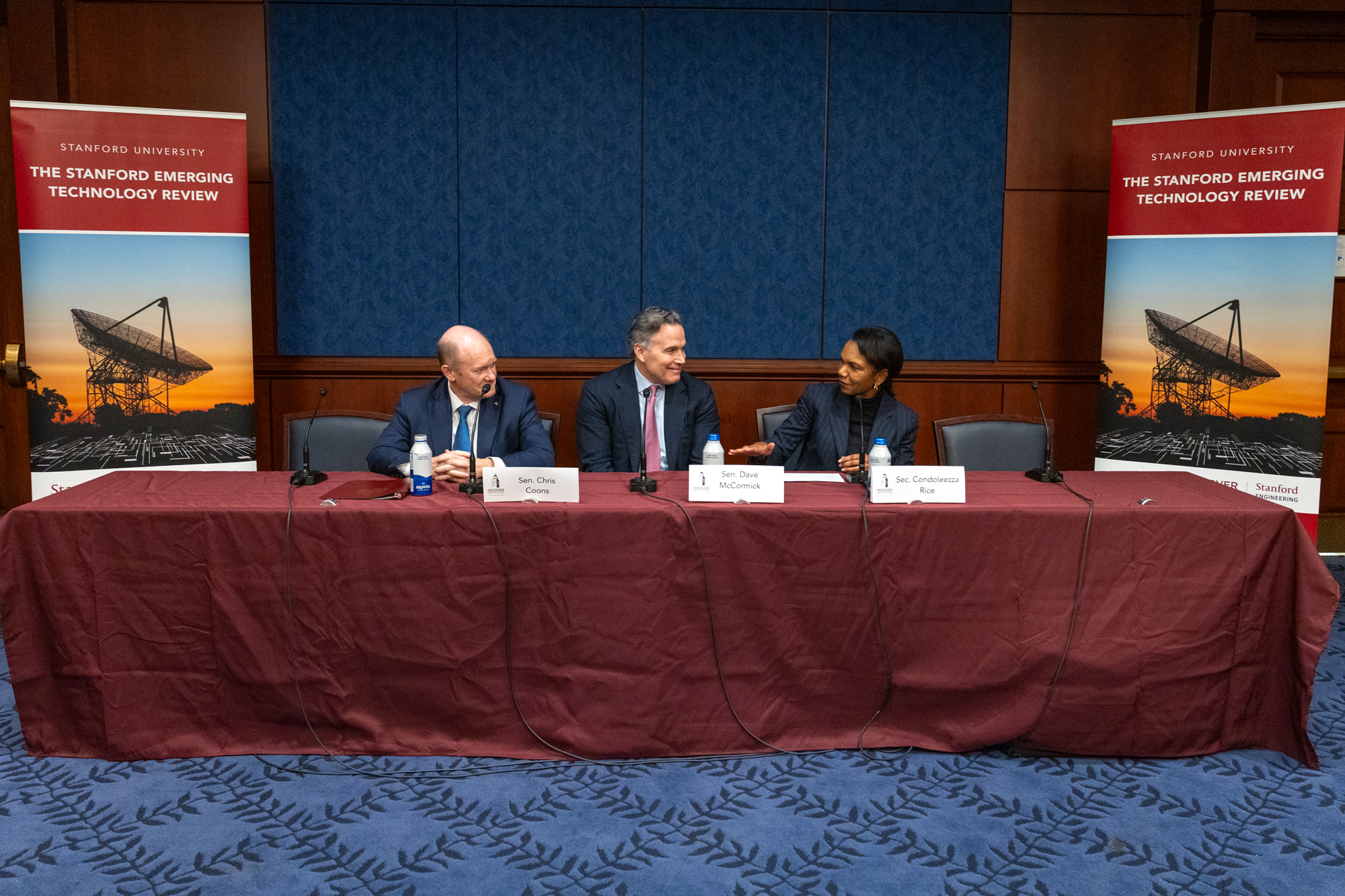 Director Rice, Senators Coons, and McCormick in conversation during their panel session.